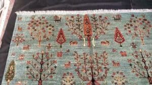 „6×8 Celeste Gabbeh Teppich – Handgeknüpfter Wollbereichsteppich mit Baum des Lebens und Tiermotiven“