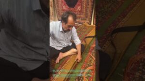 „Sewing Leather Strips onto Mashhad Wool Carpets in Iran“